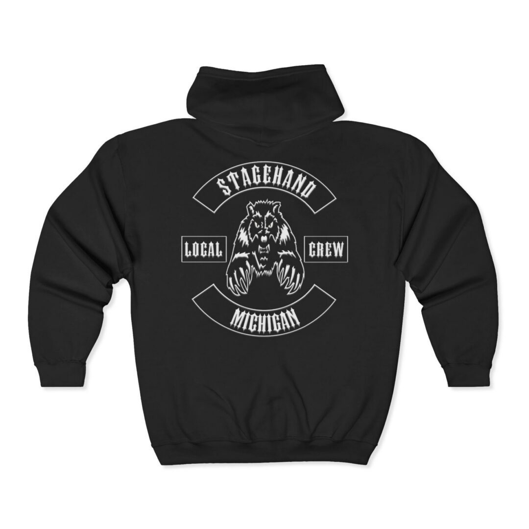 The Michigan Stagehand Crew Zip Hoodie is a black zip-up featuring a white bear graphic and the words "Stagehand," "Local Crew," and "Michigan" on the back.
