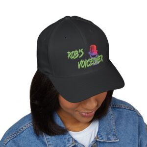 Person wearing a black baseball cap with “ROB’S VOICEOVER” and a colorful microphone graphic embroidered on the front, dressed in a light blue denim jacket.